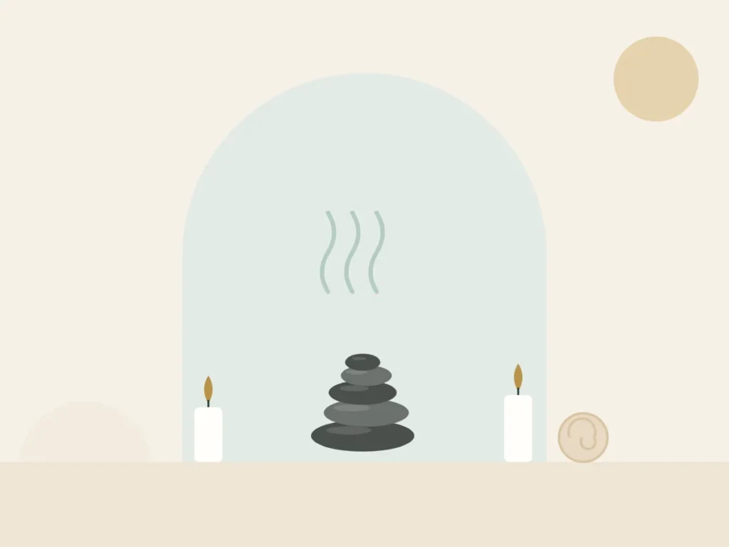 Stack of smooth basalt stones with rising steam for a hot stone massage