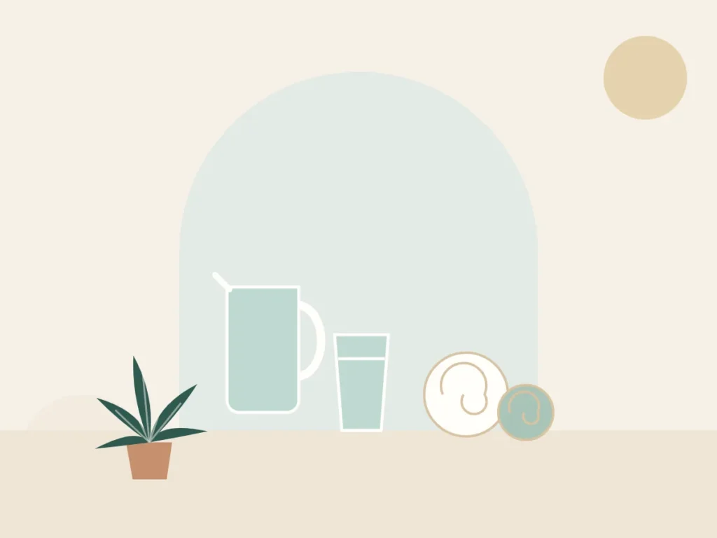 Glass of water, a jug and a rolled towel for aftercare following a massage