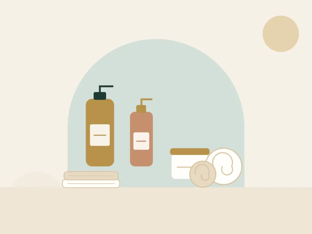 Massage oils, body cream and rolled Egyptian cotton towels used for home massage