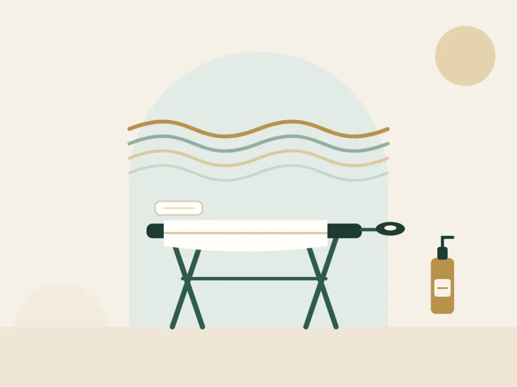 Massage table with flowing lines and an oil bottle for a Swedish massage at home